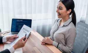 Employer Reviewing A Domestic Worker's Cv In Dubai - Imdad Center